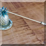 D38. Brass pineapple candle snuffer. - $8